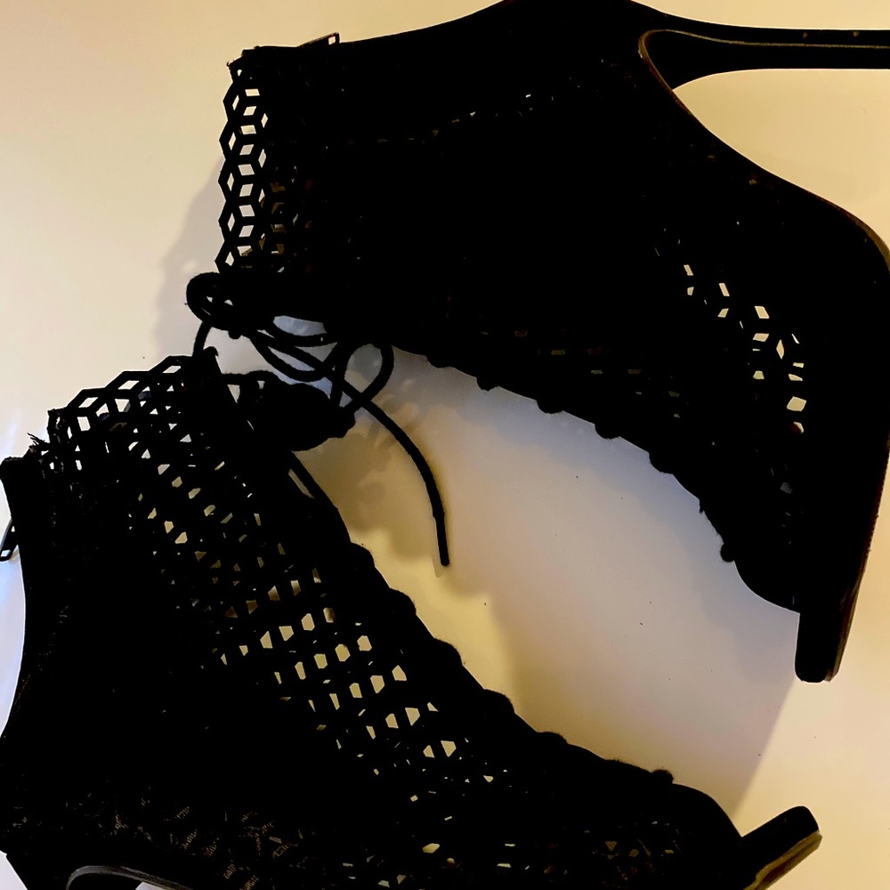 All black lace up booties.